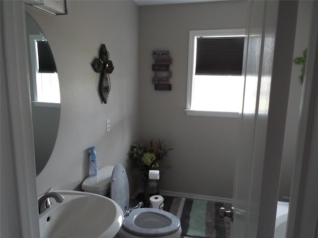 bathroom with sink and toilet