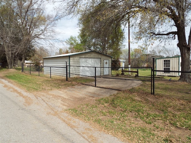 exterior space with an outdoor structure and a lawn