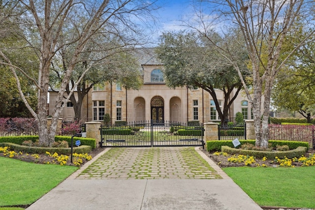 mediterranean / spanish home with a front yard