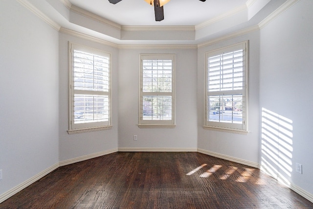 unfurnished room featuring dark hardwood / wood-style floors, ceiling fan, and a wealth of natural light