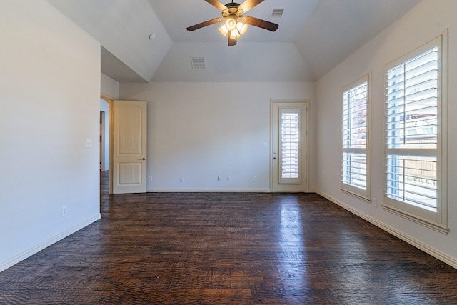 unfurnished room featuring lofted ceiling, dark wood-type flooring, and ceiling fan