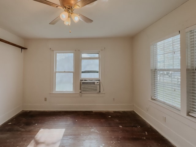 unfurnished room featuring cooling unit, dark wood-type flooring, and ceiling fan