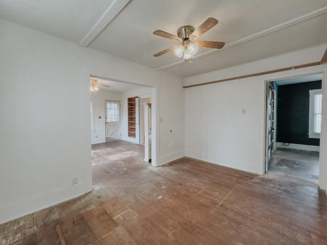 unfurnished room with ceiling fan