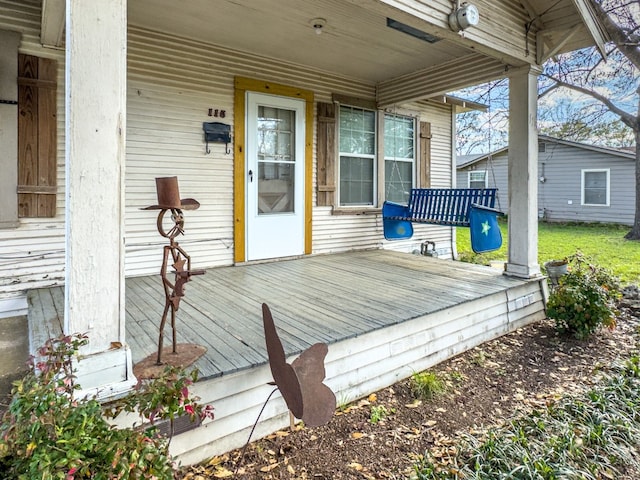 wooden terrace featuring a porch