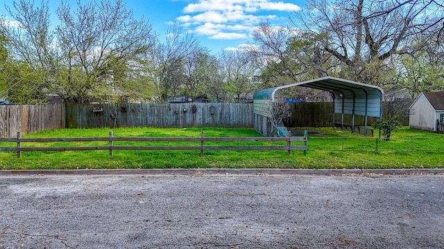 view of yard featuring a carport