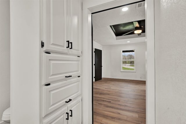 hallway with light hardwood / wood-style flooring