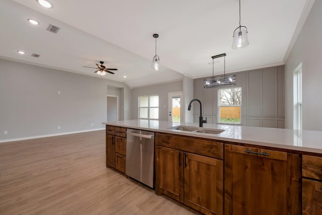 kitchen with pendant lighting, sink, stainless steel dishwasher, light hardwood / wood-style floors, and ceiling fan with notable chandelier