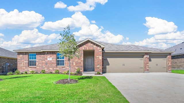 view of front of home featuring a garage and a front lawn