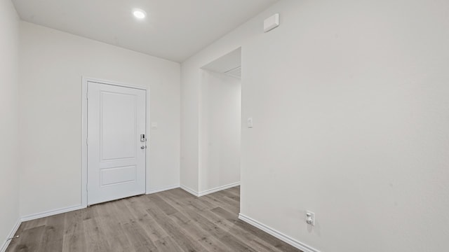 spare room featuring light hardwood / wood-style floors