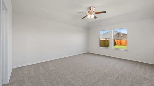 carpeted empty room featuring ceiling fan