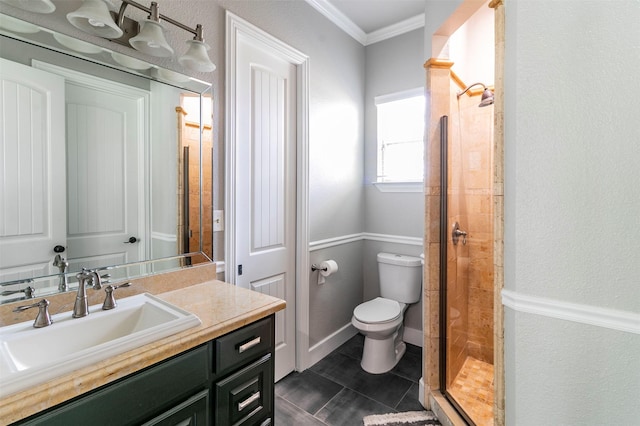 bathroom featuring vanity, tile patterned flooring, toilet, ornamental molding, and walk in shower