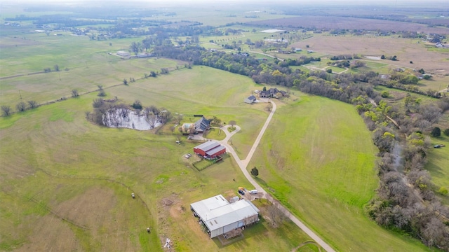 birds eye view of property featuring a rural view