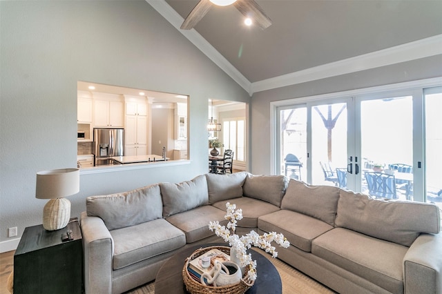 living room with crown molding, ceiling fan, high vaulted ceiling, and light wood-type flooring