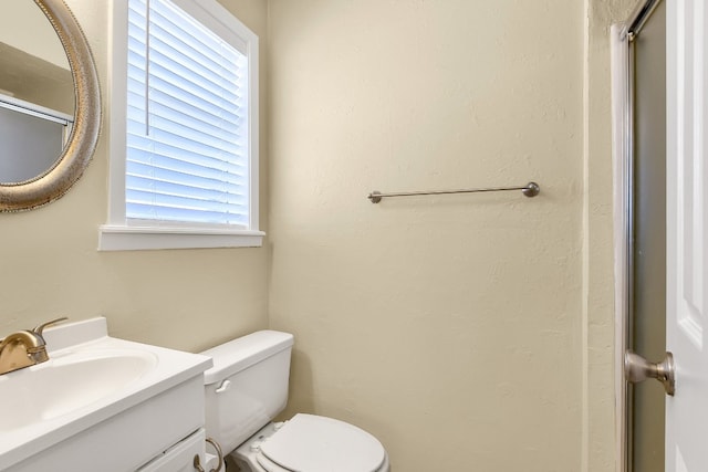 bathroom with oversized vanity and toilet