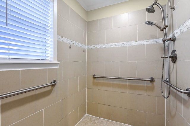 bathroom with a tile shower