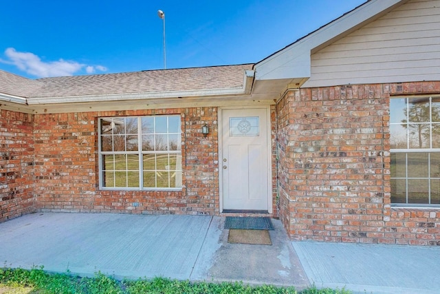 property entrance with a patio area