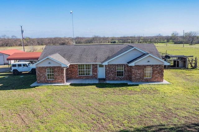 ranch-style house with a front lawn