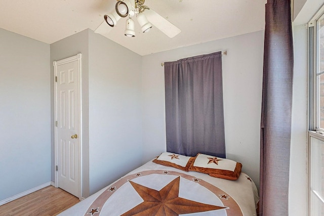 bedroom featuring light hardwood / wood-style floors and ceiling fan