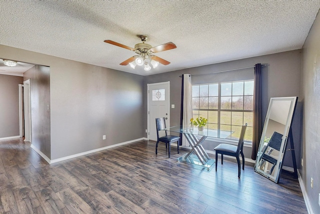 sitting room featuring a textured ceiling, dark hardwood / wood-style flooring, and ceiling fan