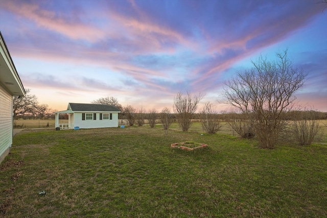 view of yard at dusk