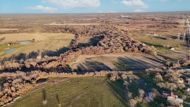 birds eye view of property featuring a rural view