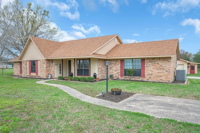 ranch-style house featuring central AC unit and a front yard