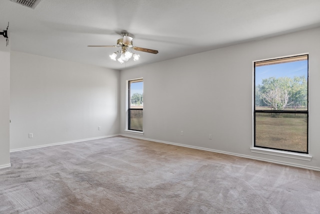 carpeted empty room with ceiling fan