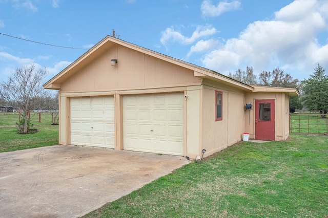 garage featuring a lawn