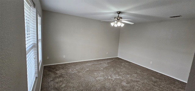 carpeted empty room featuring ceiling fan