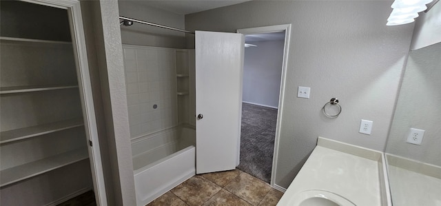 bathroom with tile flooring and shower / tub combination