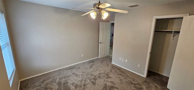 unfurnished bedroom with a closet, ceiling fan, and dark colored carpet