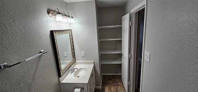 bathroom featuring tile flooring and vanity