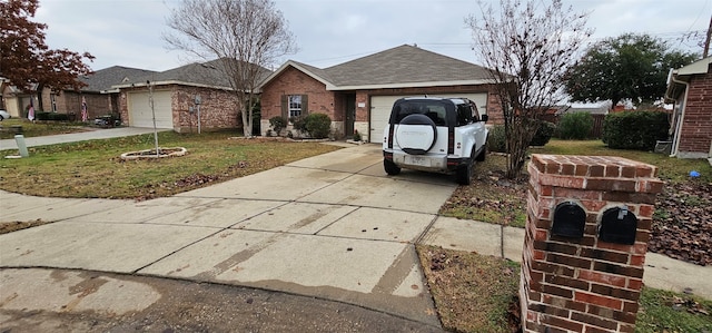 single story home featuring a front lawn and a garage