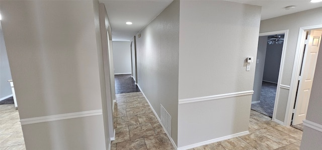 hallway with light tile floors