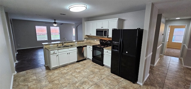 kitchen featuring ceiling fan, kitchen peninsula, black appliances, white cabinetry, and sink