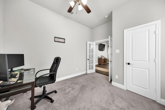 carpeted office featuring ceiling fan