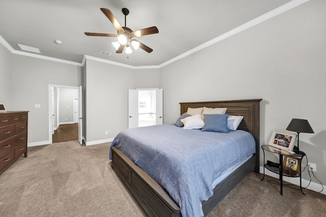 carpeted bedroom featuring ceiling fan and crown molding