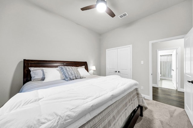 carpeted bedroom featuring a closet and ceiling fan