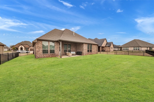 back of property featuring a lawn and a patio area