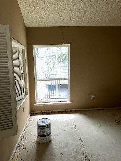 spare room featuring a textured ceiling