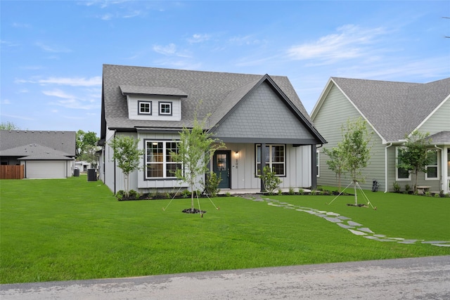 view of front facade featuring a front yard and a garage