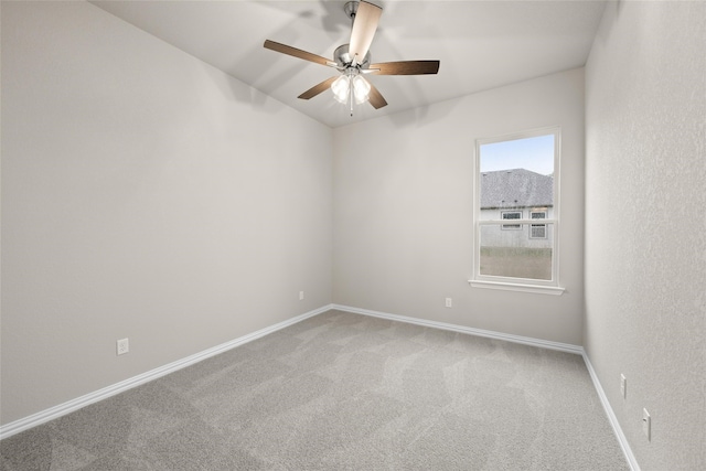 unfurnished room with carpet and ceiling fan