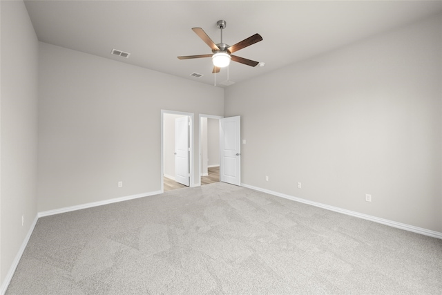 unfurnished bedroom with ceiling fan and light carpet