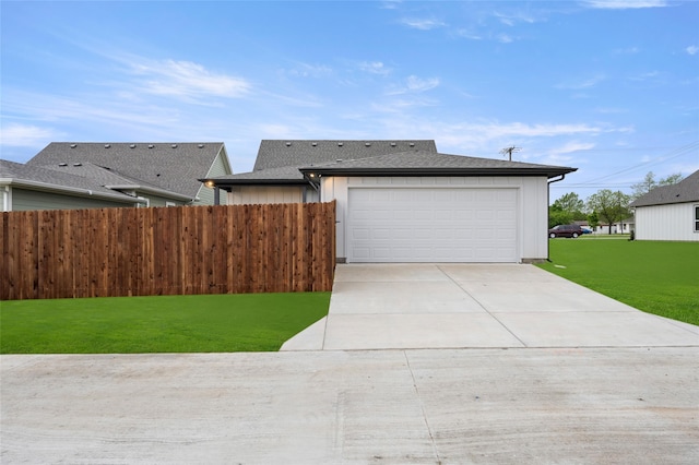 view of front of home with a garage and a front yard