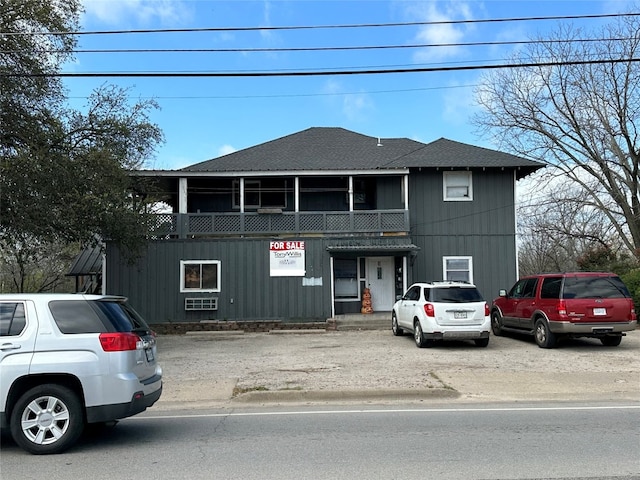 front of property featuring a balcony