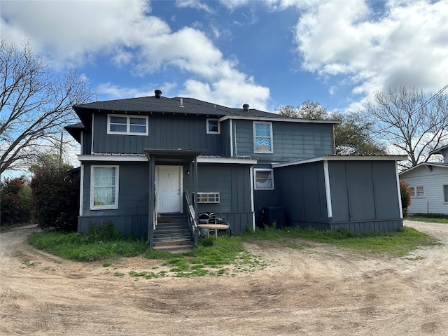 rear view of property with central air condition unit