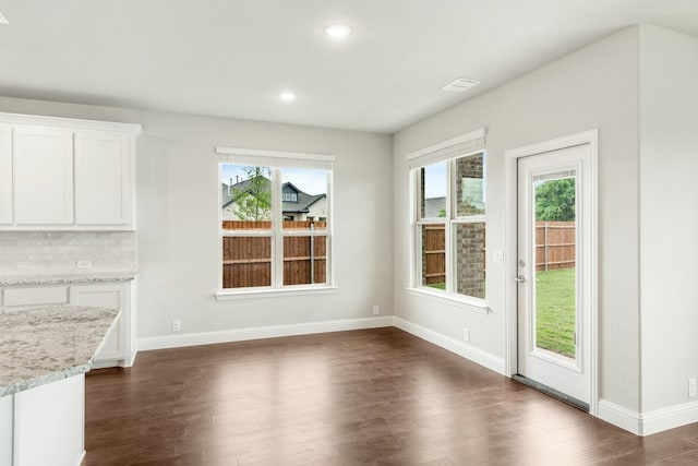 empty room featuring ceiling fan and dark hardwood / wood-style floors