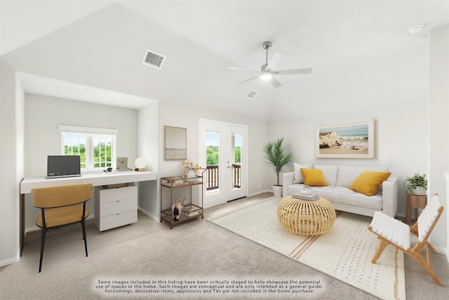 empty room with light carpet, ceiling fan, and vaulted ceiling