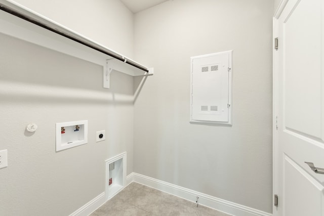 laundry room featuring hookup for an electric dryer, hookup for a gas dryer, light tile floors, and hookup for a washing machine