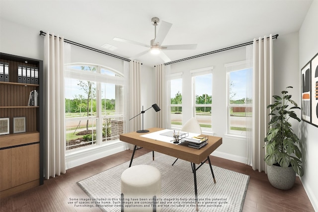 unfurnished room with a healthy amount of sunlight, ceiling fan, french doors, and dark wood-type flooring